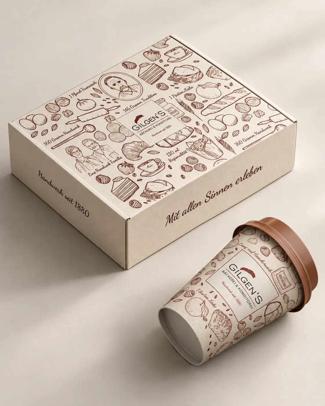 Gilgens Gebäckbox und Kaffeebecher im neuen Corporate Design